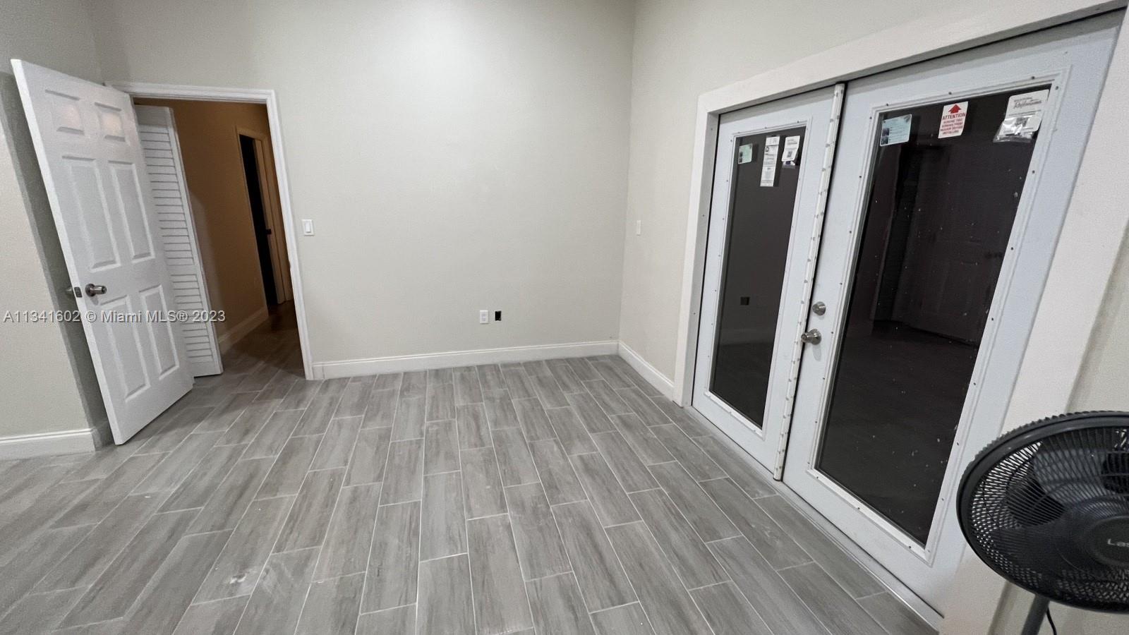 Sunset Miami, FL 33173 - Photo 22 of 41 an empty room with wooden floor and entrance