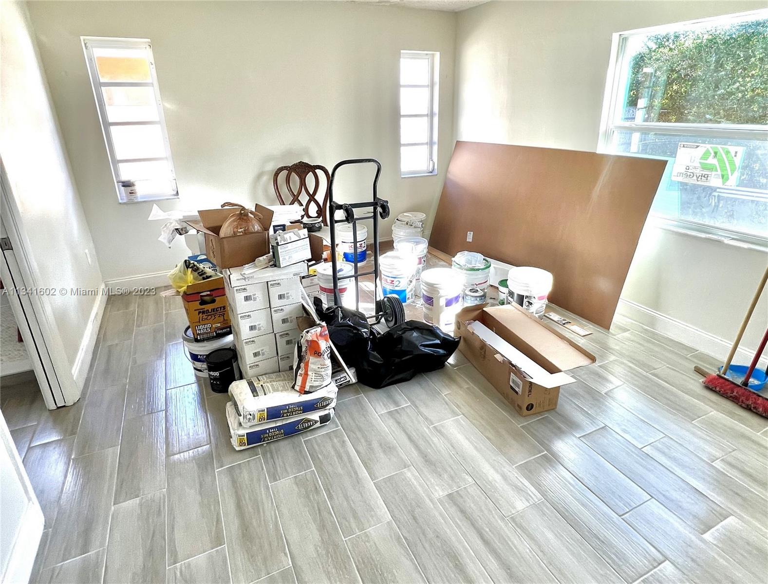 Sunset Miami, FL 33173 - Photo 23 of 41 a living room with furniture and a wooden floor