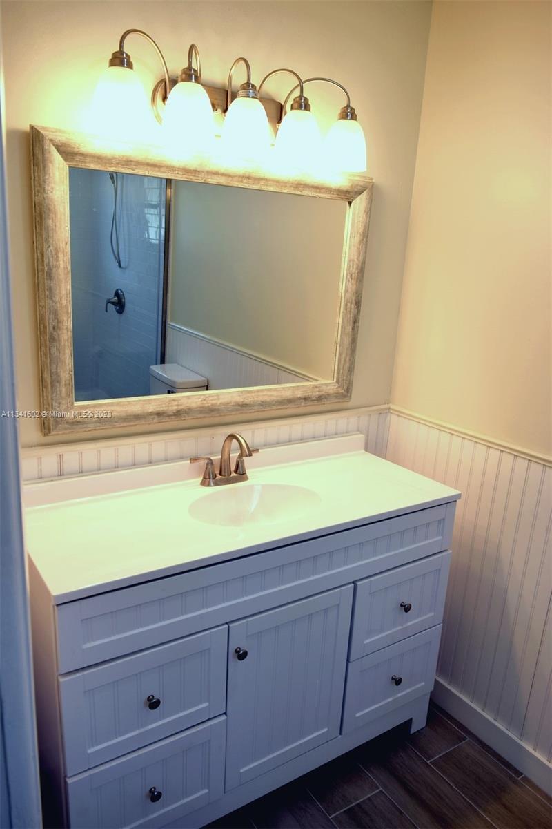 Sunset Miami, FL 33173 - Photo 27 of 41 a bathroom with a sink and a mirror