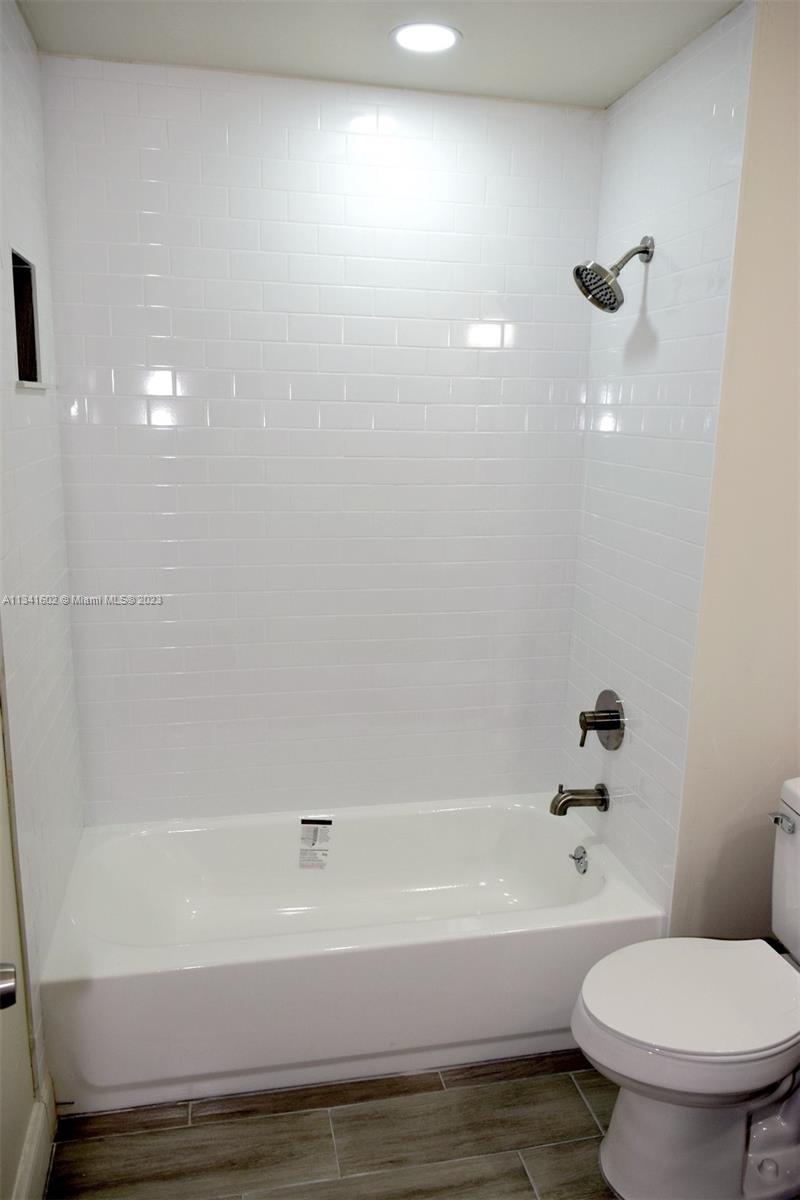 Sunset Miami, FL 33173 - Photo 34 of 41 a bathroom with a bathtub and a toilet