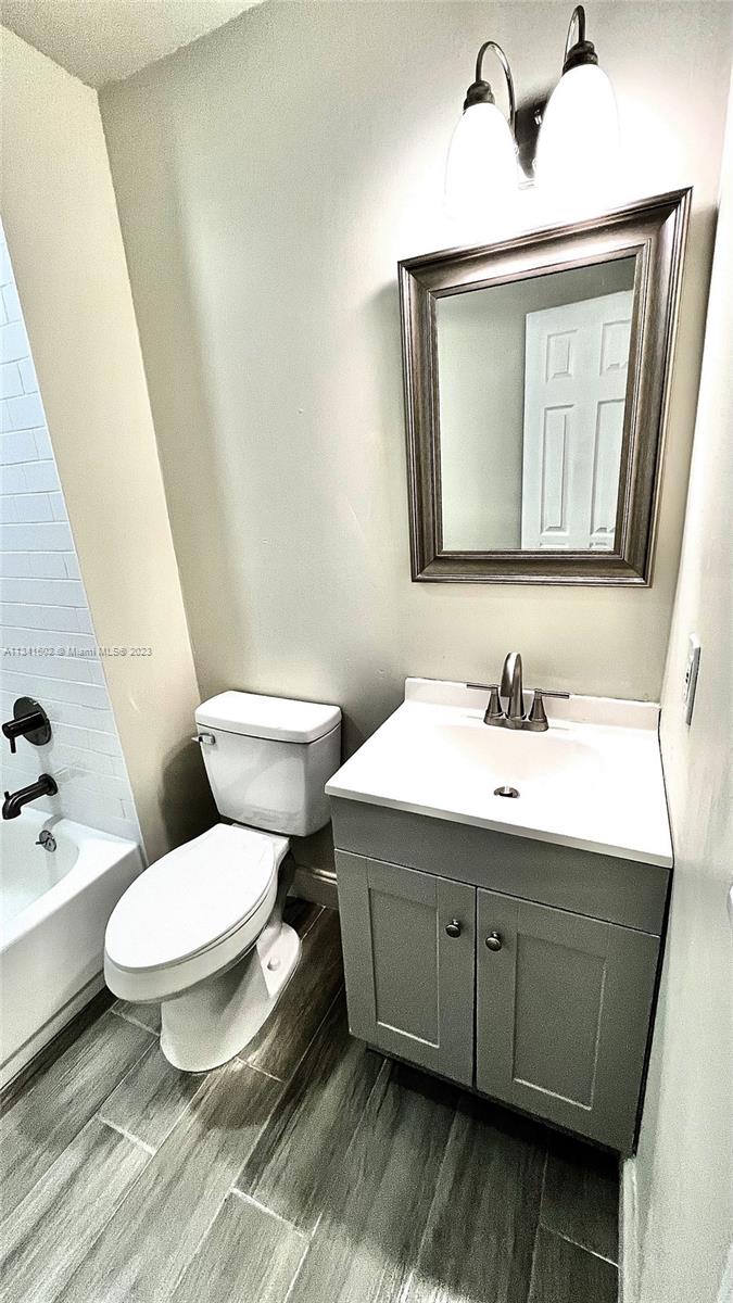 Sunset Miami, FL 33173 - Photo 35 of 41 a bathroom with a toilet sink and mirror