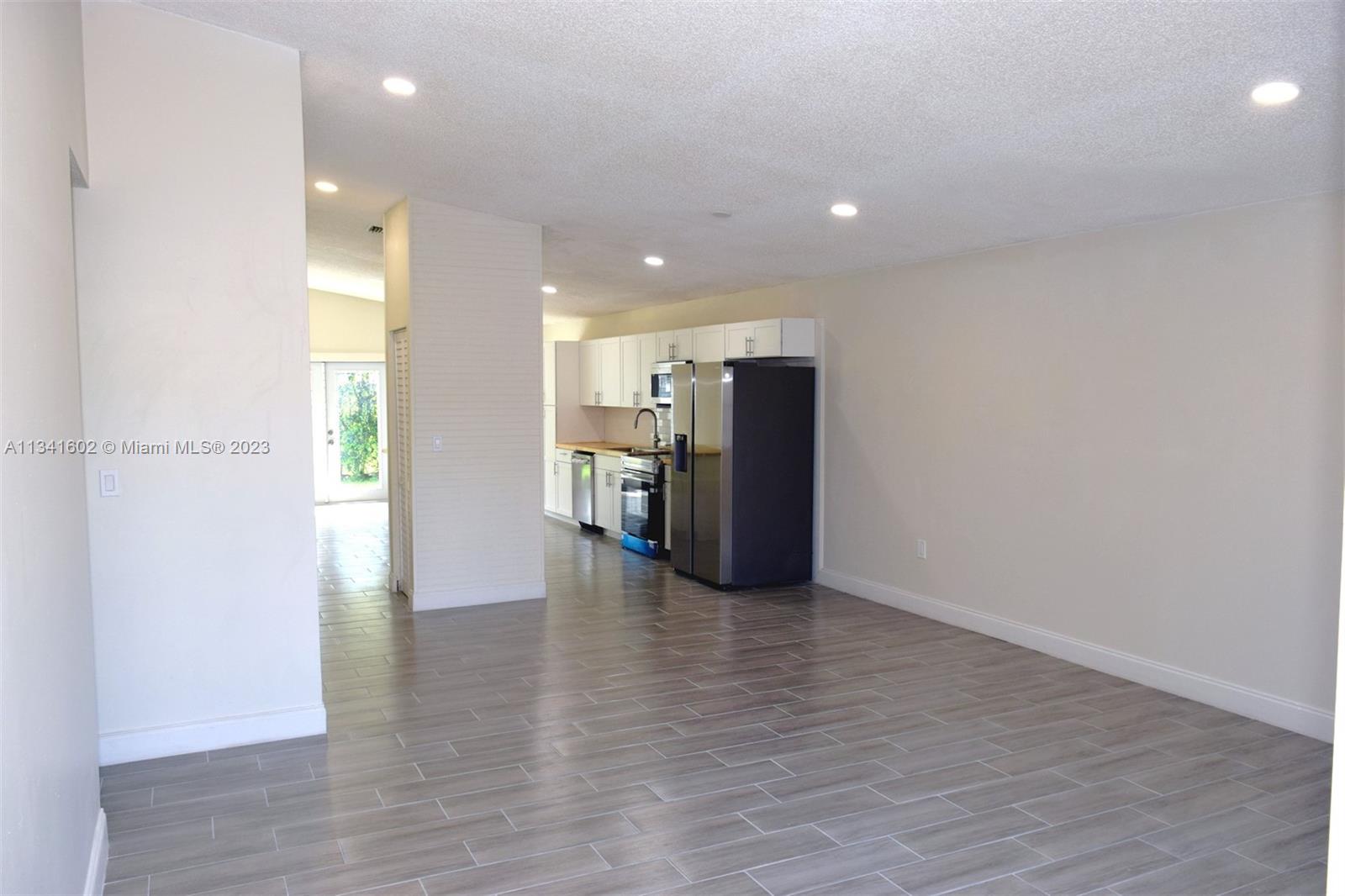 Sunset Miami, FL 33173 - Photo 6 of 41 a view of kitchen with refrigerator and window