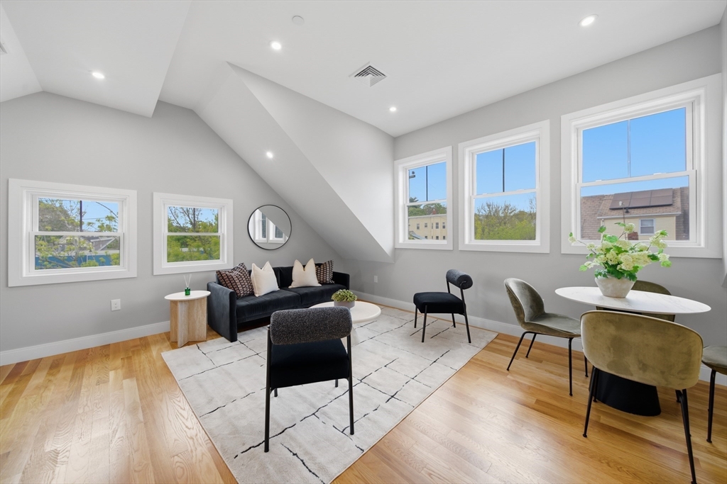 174 Walnut Street, Unit 3 Somerville, MA 02145 - Photo 27 of 38 a living room with furniture and a window