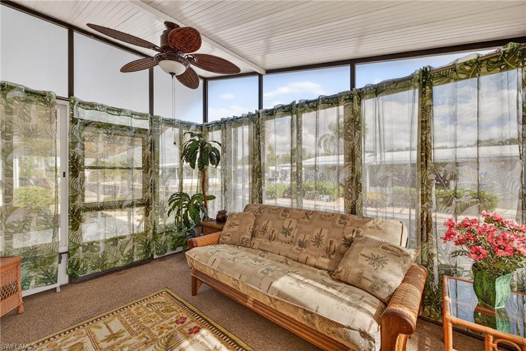 212 Oceans Boulevard, Unit 212 Naples, FL 34104 - Photo 21 of 30 a living room with furniture
