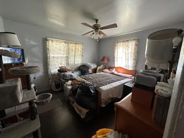 a bedroom with furniture and a window