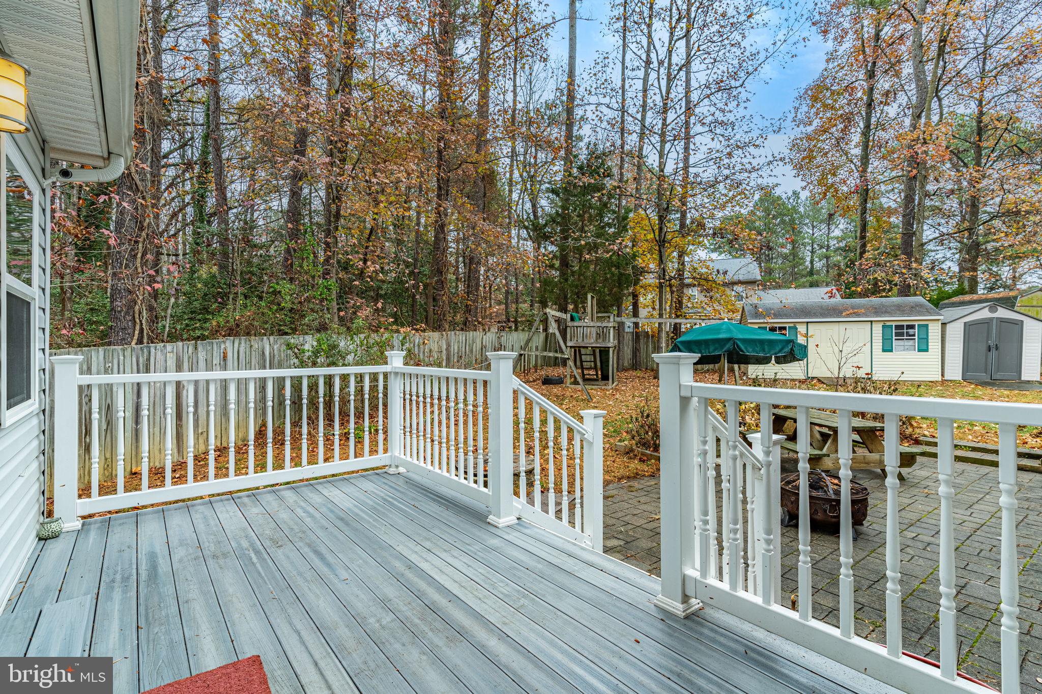 868 Crystal Rock Road Lusby, MD 20657 - Photo 27 of 37 Trex decking & patio off of family room