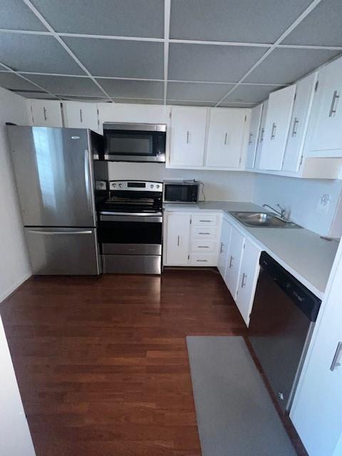 2615 Northeast 3rd Street, Unit 412 Boynton Beach, FL 33435 - Photo 2 of 14 a kitchen with stainless steel appliances a refrigerator and a stove top oven