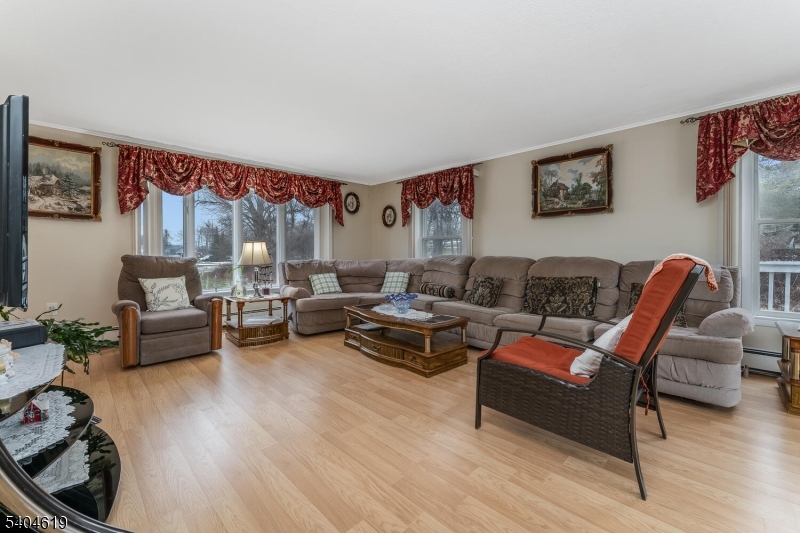 11 Cemetery Road Blairstown, NJ 07825 - Photo 18 of 34 a living room with furniture and a wooden floor