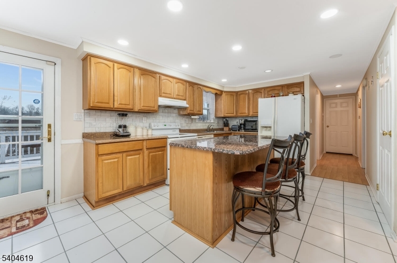 11 Cemetery Road Blairstown, NJ 07825 - Photo 21 of 34 a kitchen with a sink a counter top space cabinets and stainless steel appliances