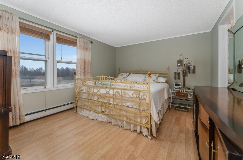 11 Cemetery Road Blairstown, NJ 07825 - Photo 25 of 34 a bedroom with a bed and a dresser next to a window