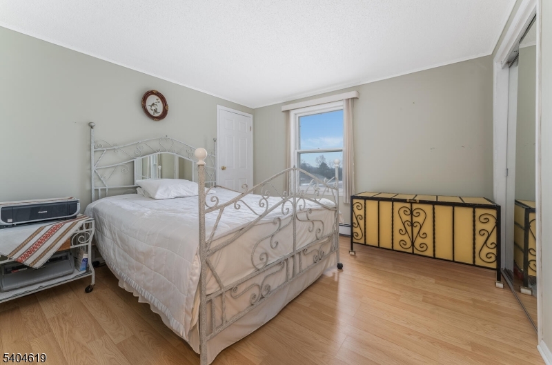 11 Cemetery Road Blairstown, NJ 07825 - Photo 27 of 34 a bed sitting in a bedroom next to a window