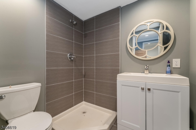 11 Cemetery Road Blairstown, NJ 07825 - Photo 31 of 34 a bathroom with a toilet a sink and mirror