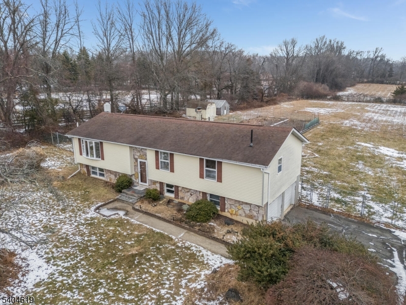 11 Cemetery Road Blairstown, NJ 07825 - Photo 6 of 34 a view of a house with a yard covered in snow
