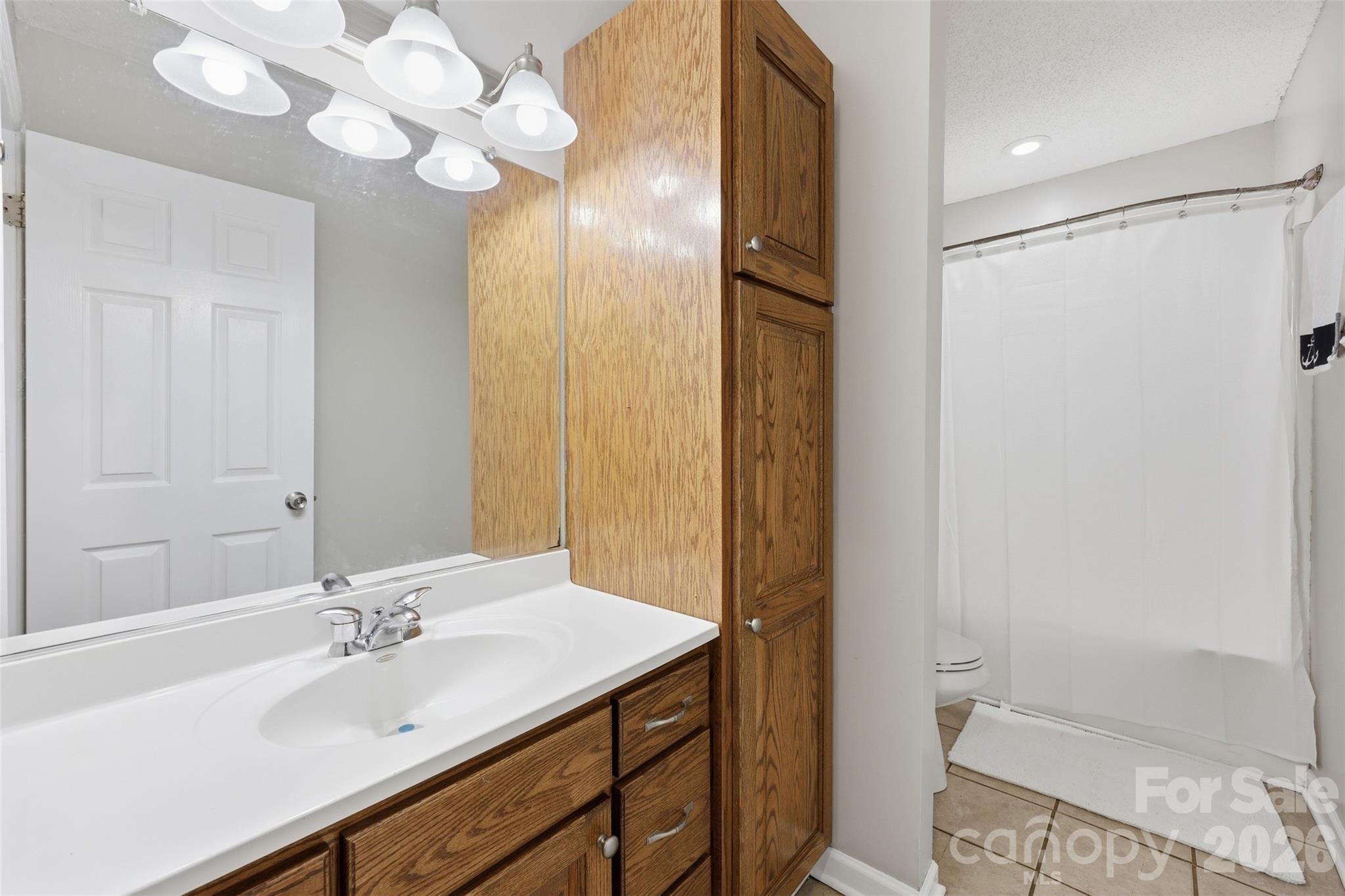 1214 Eastcreek Road Fort Lawn, SC 29714 - Photo 17 of 28 a bathroom with a sink mirror and a shower