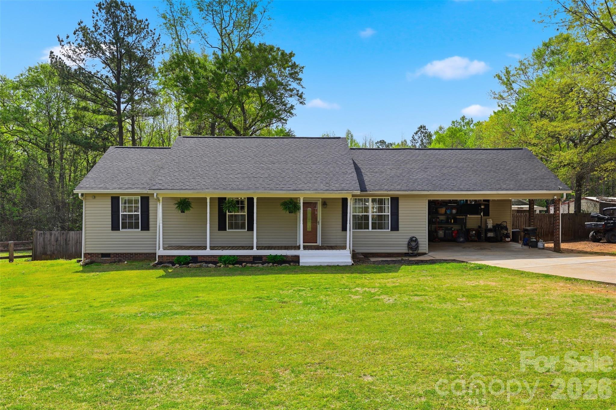 1214 Eastcreek Road Fort Lawn, SC 29714 - Photo 20 of 28 a view of a white house with a large yard and large trees