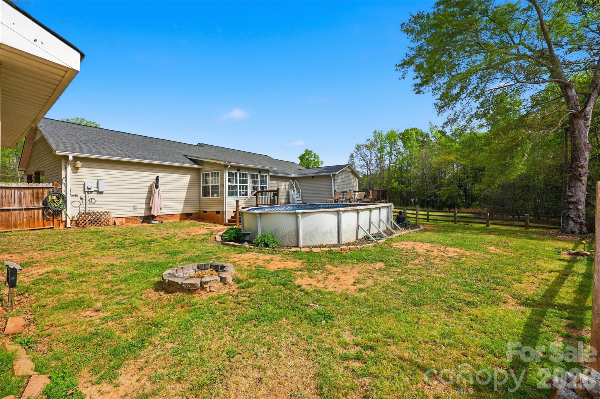 1214 Eastcreek Road Fort Lawn, SC 29714 - Photo 22 of 28 a house view with swimming pool in front of it