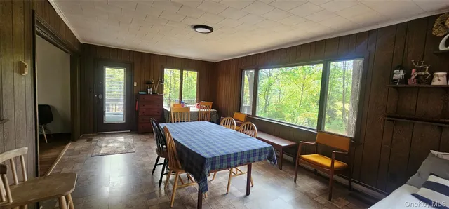 a dining room with furniture and window