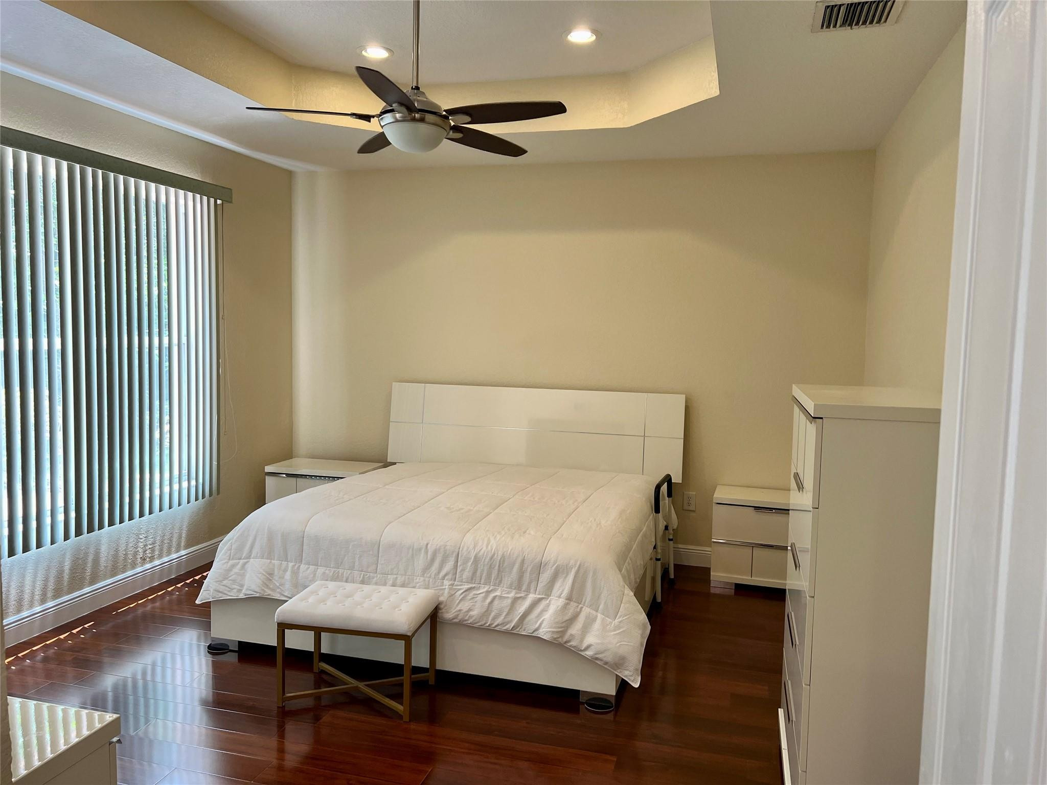 5201 Southwest 173rd Avenue Miramar, FL 33029 - Photo 12 of 42 a bedroom with a bed and wooden floor