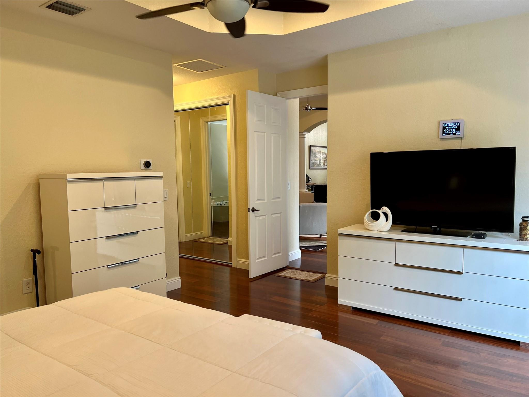 5201 Southwest 173rd Avenue Miramar, FL 33029 - Photo 20 of 42 a bedroom with a bed and flat screen tv