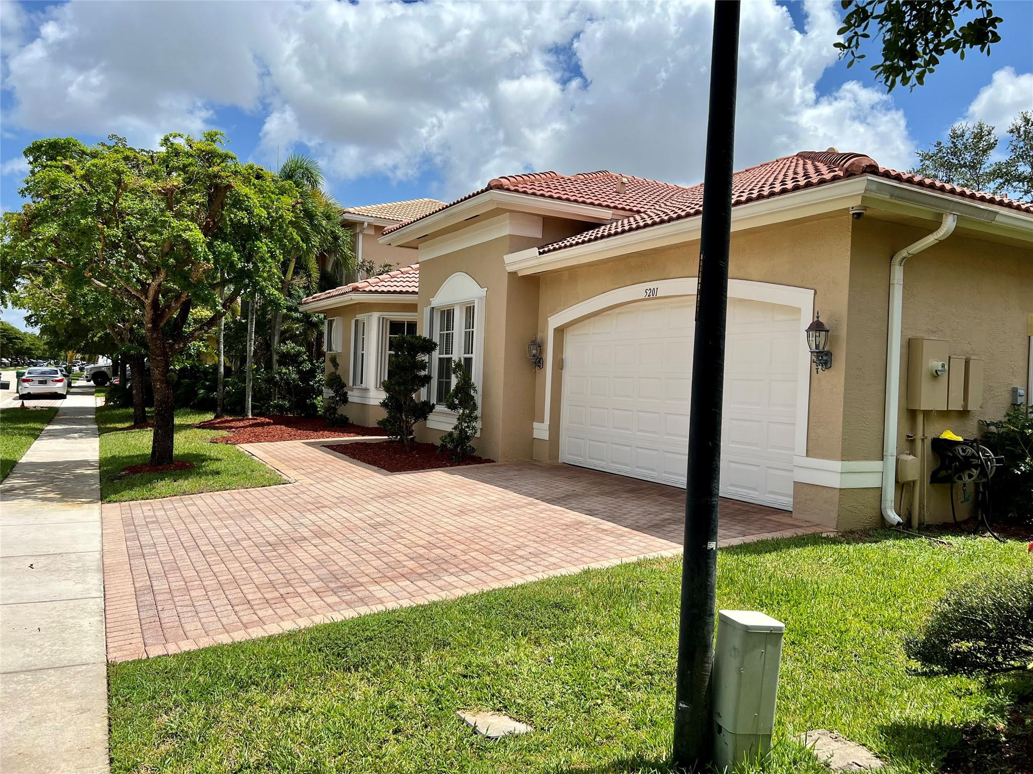 5201 Southwest 173rd Avenue Miramar, FL 33029 - Photo 2 of 42 a front view of house with yard and green space