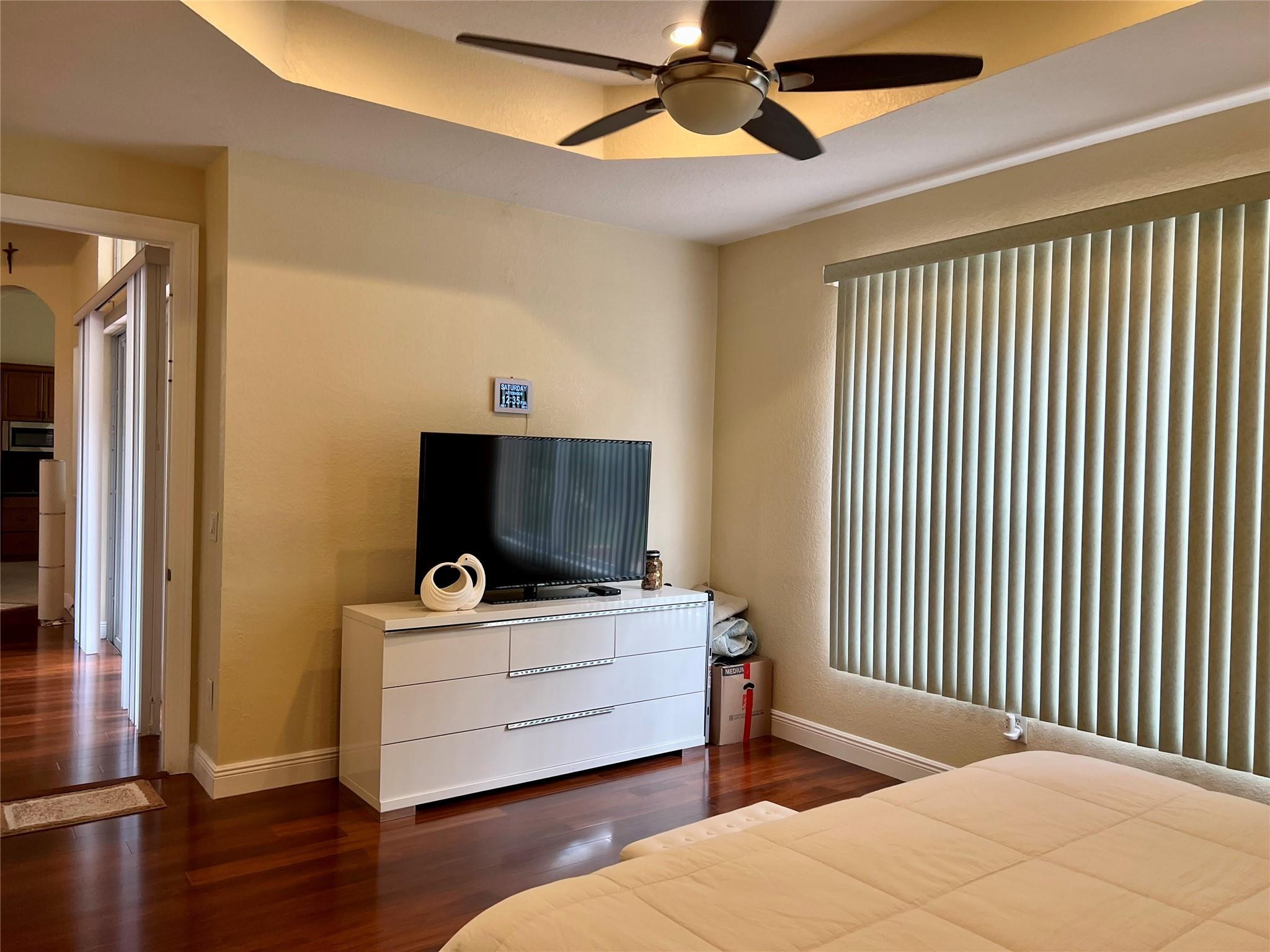 5201 Southwest 173rd Avenue Miramar, FL 33029 - Photo 21 of 42 a bedroom with a bed and a flat screen tv