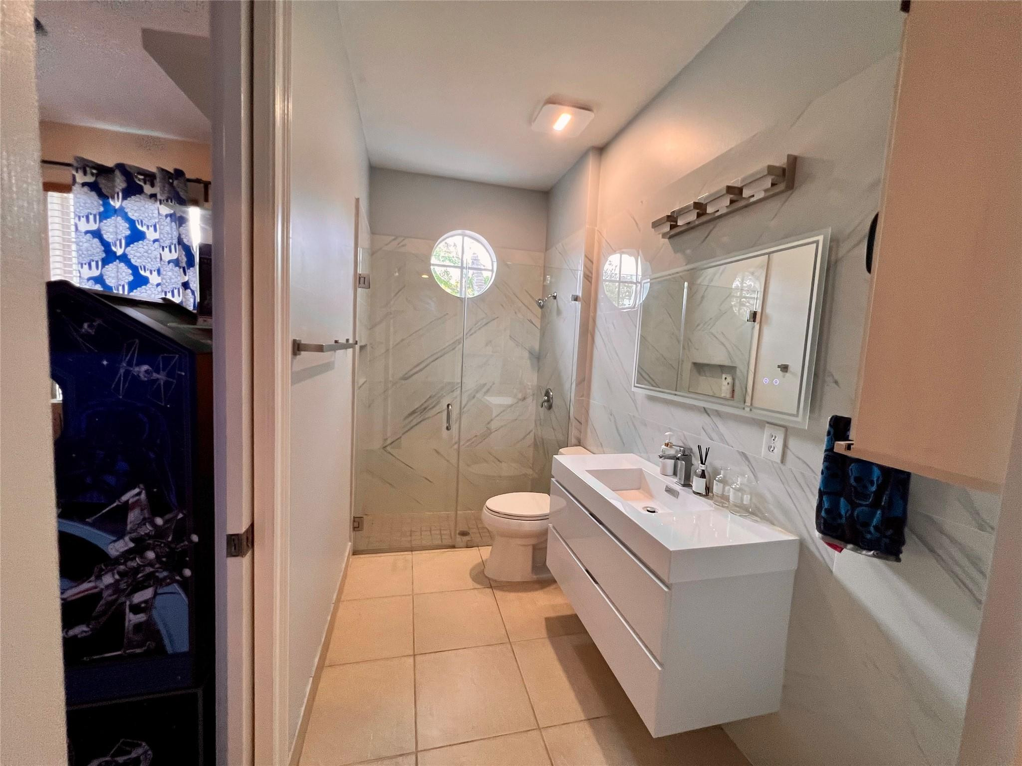 5201 Southwest 173rd Avenue Miramar, FL 33029 - Photo 35 of 42 a bathroom with a double vanity sink mirror and shower