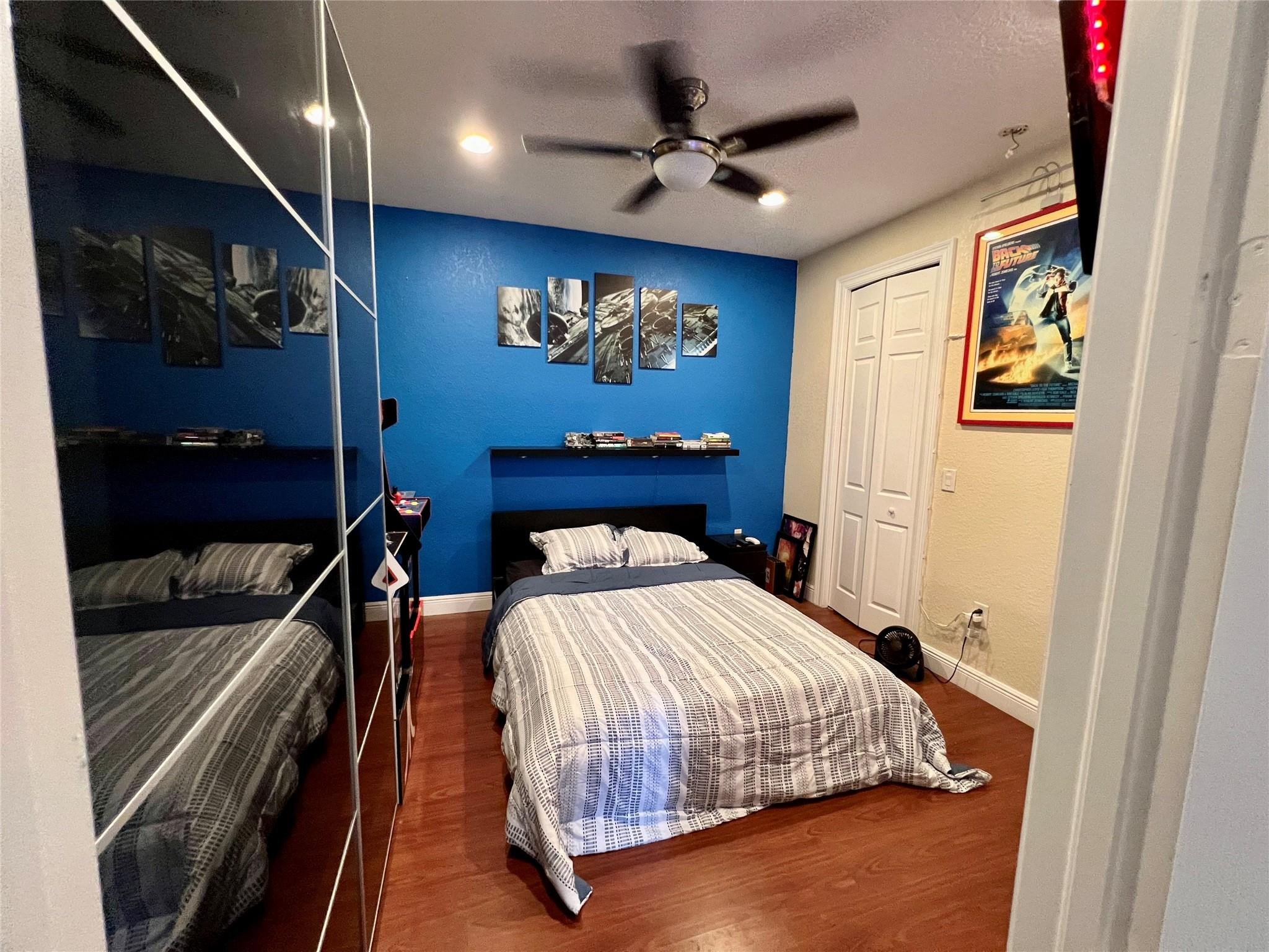 5201 Southwest 173rd Avenue Miramar, FL 33029 - Photo 36 of 42 a bedroom with a bed and a chandelier