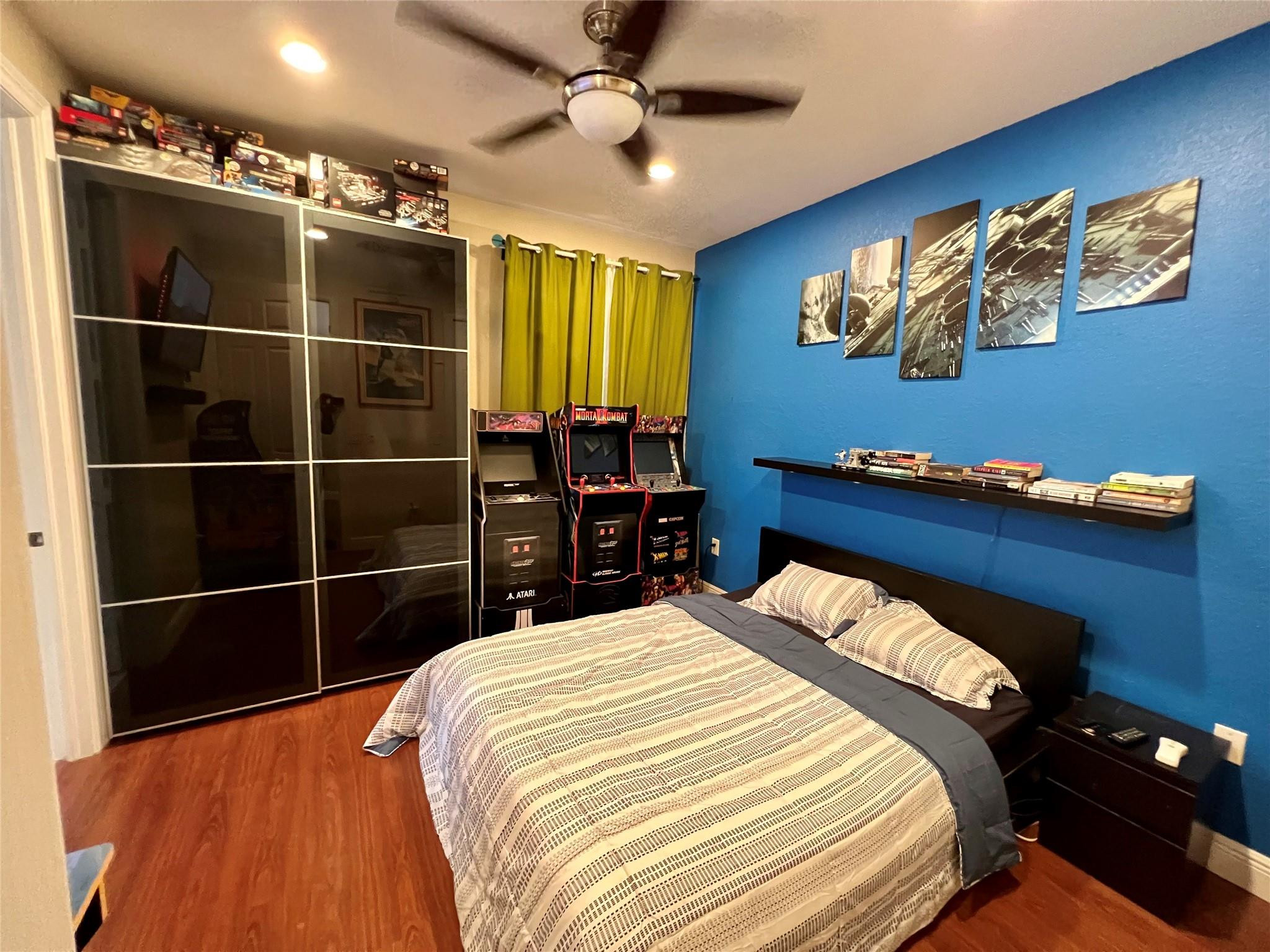 5201 Southwest 173rd Avenue Miramar, FL 33029 - Photo 38 of 42 a bedroom with a bed and a chandelier