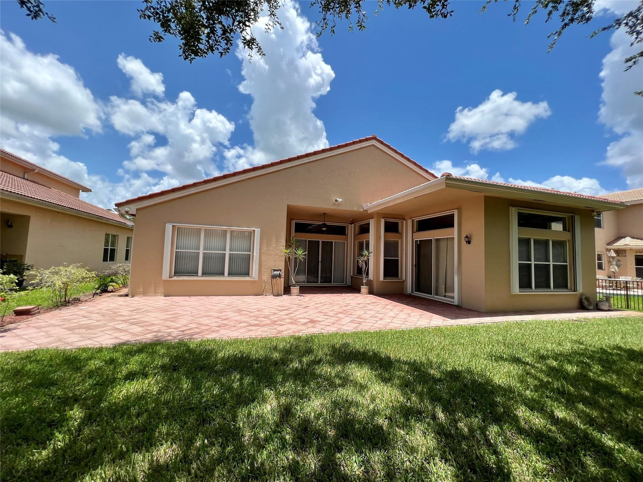 5201 Southwest 173rd Avenue Miramar, FL 33029 - Photo 40 of 42 a front view of a house with a garden