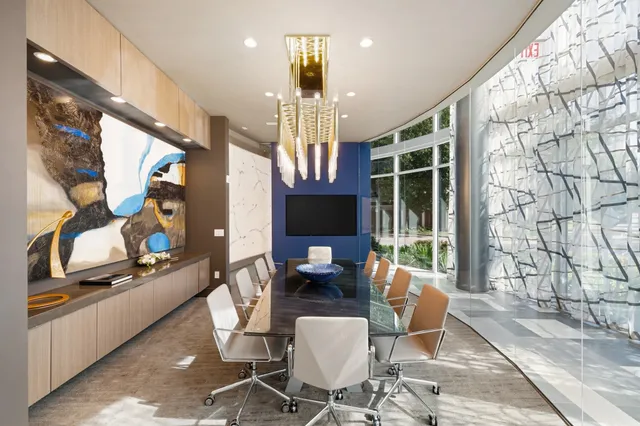 a view of a big room with lots of tables and chairs