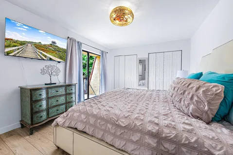 a bedroom with a bed and a table