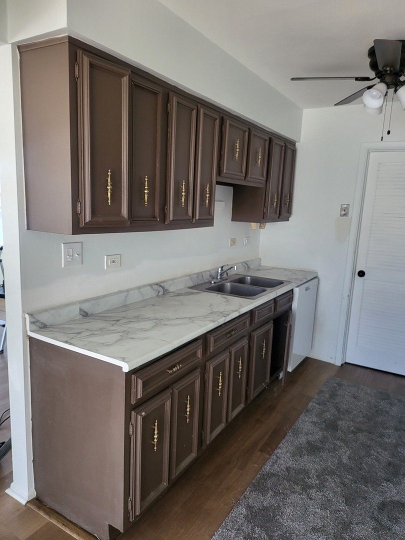 766 Mendocino Court, Unit 3 University Park, IL 60484 - Photo 3 of 5 a kitchen with a stove and a sink