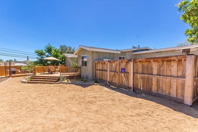 2505 Littleton Road El Cajon, CA 92020 - Photo 23 of 24 Rear yard. Other side of fence is an enclosed patio off the garage. Lots of versatility!