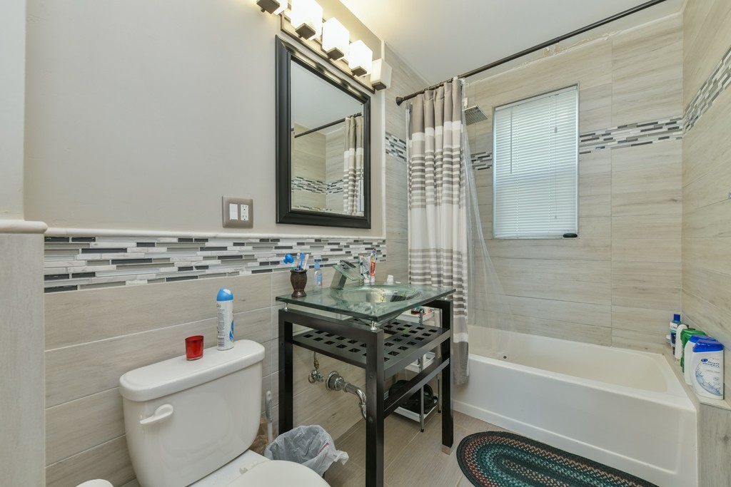 17-19 Pleasant Street Boston, MA 02125 - Photo 8 of 16 a bathroom with a sink a toilet and a bathtub