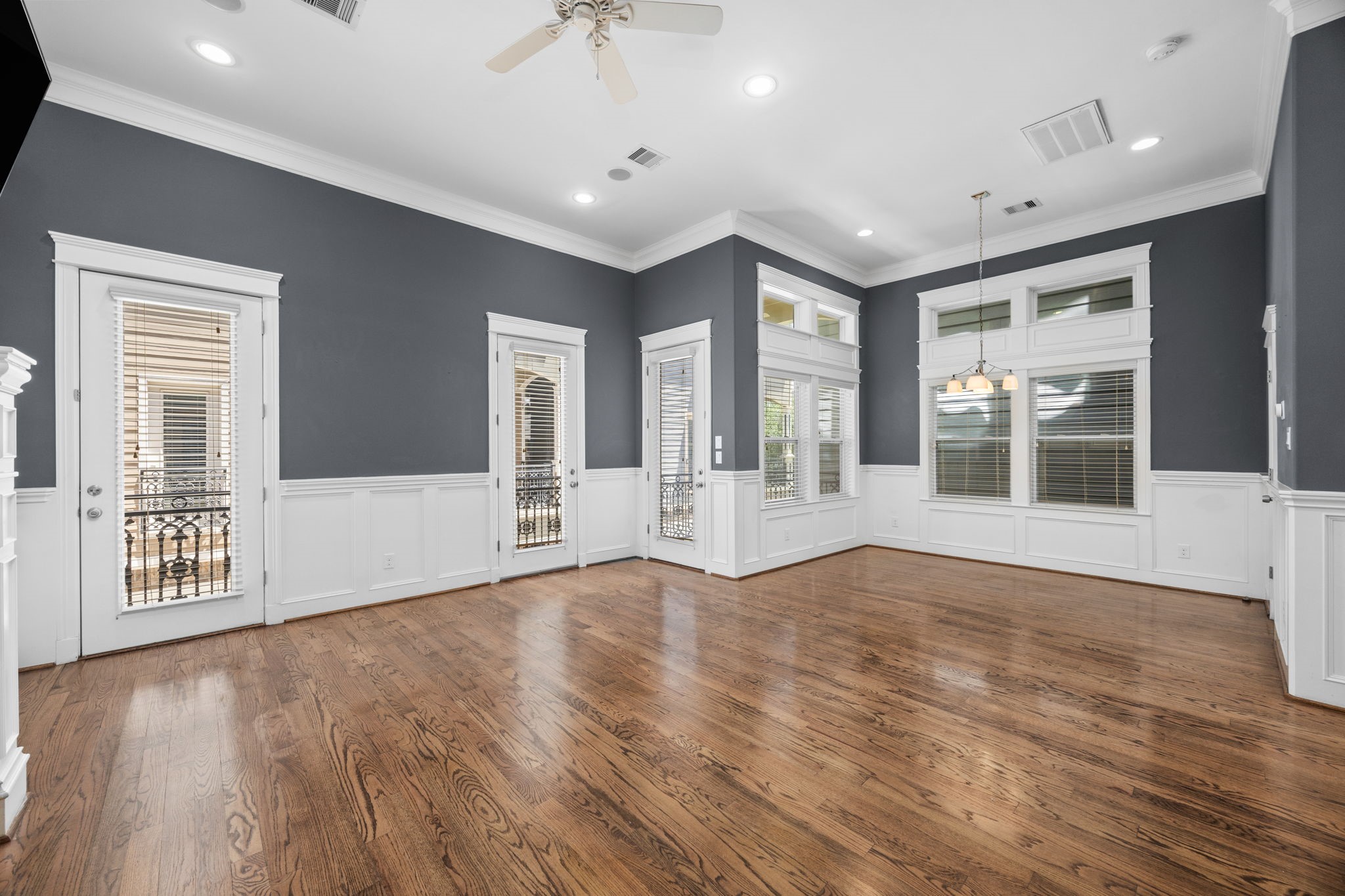 619 Rutland Street, Unit B Houston, TX 77007 - Photo 8 of 33 a view of an empty room with wooden floor and a window