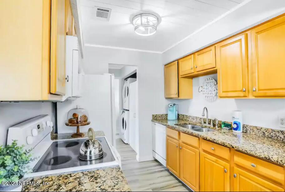 11 Clipper Court St. Augustine, FL 32080 - Photo 11 of 23 a kitchen with stainless steel appliances granite countertop a sink dishwasher stove and cabinets with wooden floor