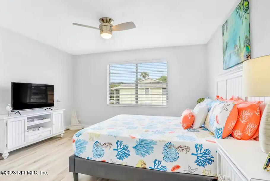 11 Clipper Court St. Augustine, FL 32080 - Photo 15 of 23 a bedroom with a bed a television and a window