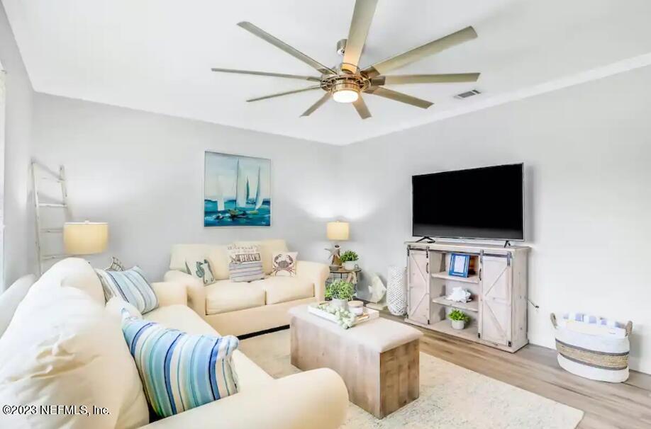 11 Clipper Court St. Augustine, FL 32080 - Photo 6 of 23 a living room with furniture and a flat screen tv