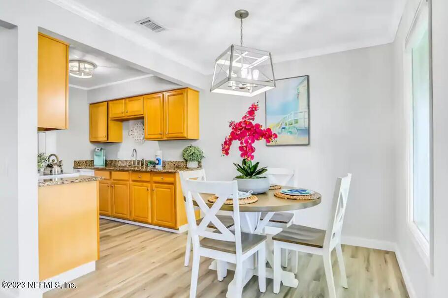 11 Clipper Court St. Augustine, FL 32080 - Photo 8 of 23 a view of a dining room with furniture and wooden floor