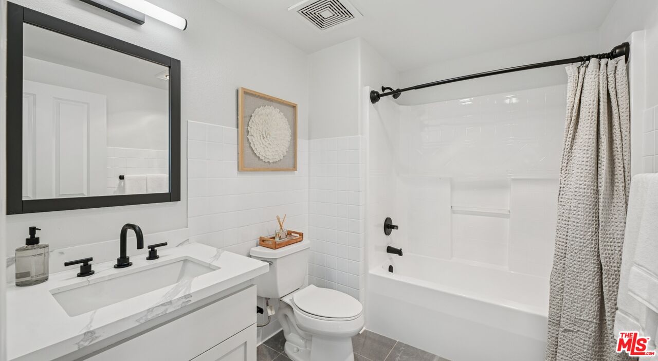 290 North Hudson Avenue, Unit 208W Pasadena, CA 91101 - Photo 20 of 21 a bathroom with a sink toilet and shower