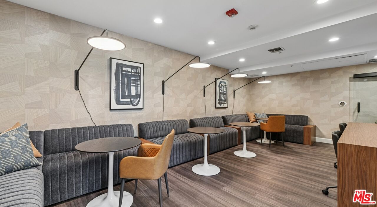 290 North Hudson Avenue, Unit 208W Pasadena, CA 91101 - Photo 7 of 21 a living room with furniture and wooden floor