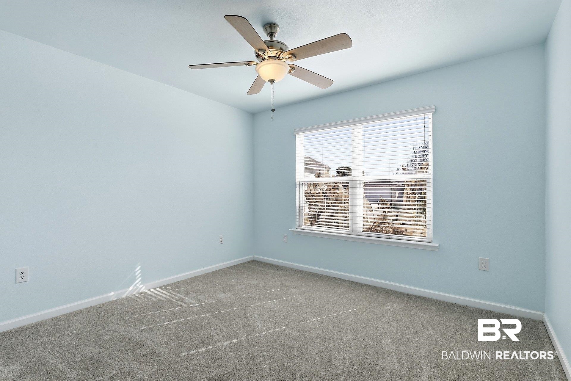 983 Summerton Drive Foley, AL 36535 - Photo 19 of 25 Carpeted spare room with baseboards and a ceiling fan