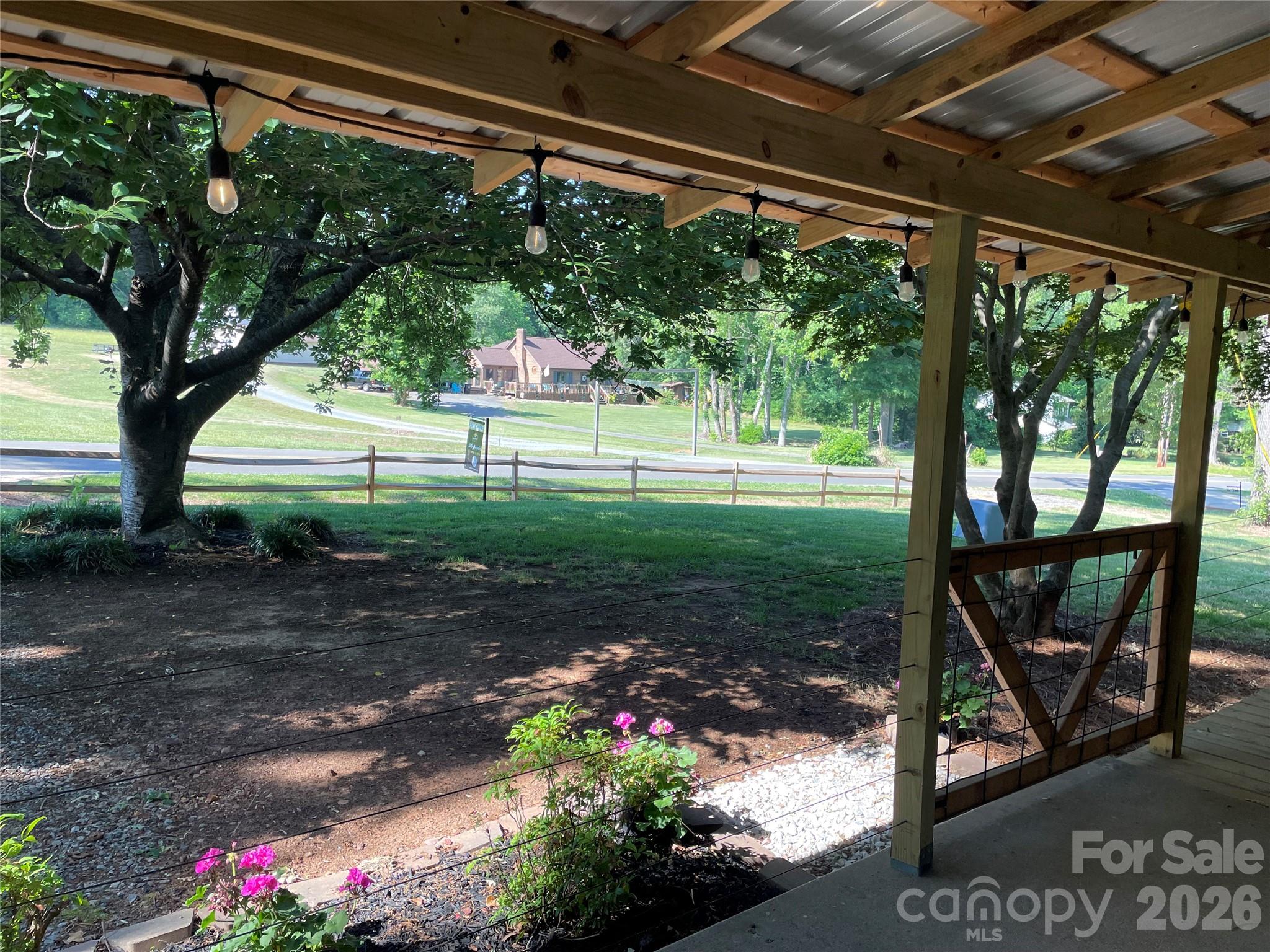 511 Sunbeam Farm Road Cherryville, NC 28021 - Photo 2 of 29 a view of a porch with a backyard