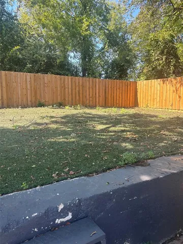 a view of a backyard with green space