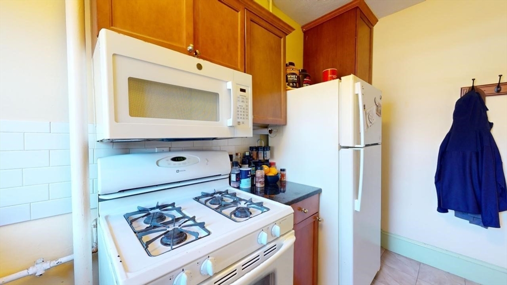 131 Park Drive, Unit 31 Boston, MA 02215 - Photo 6 of 15 a utility room with dryer and washer