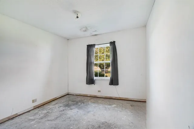 a view of a room that has a window in it