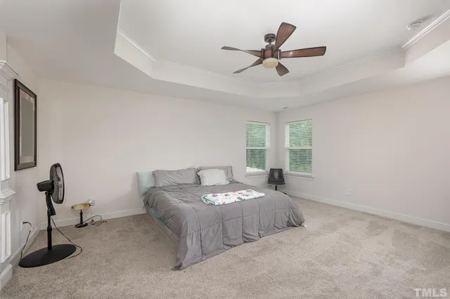 a bedroom with bed and window