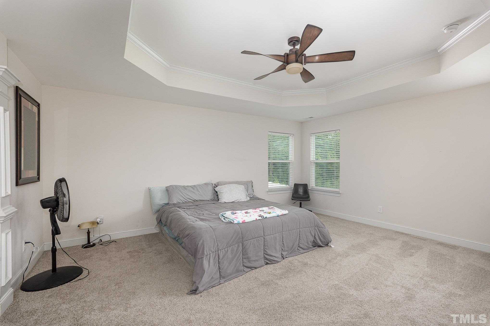 1513 Slate Ridge Road Knightdale, NC 27545 - Photo 16 of 36 a bedroom with bed and window