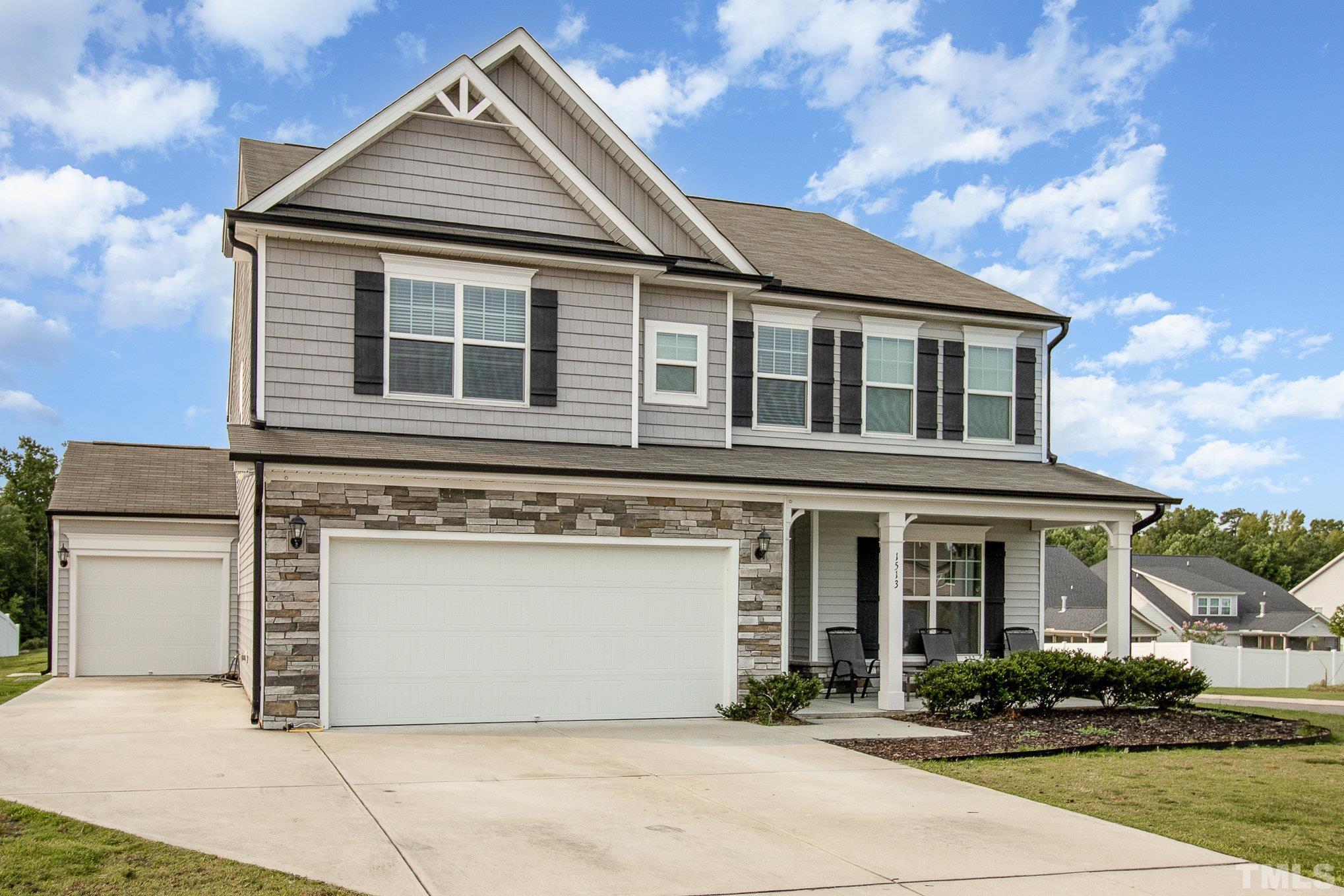 1513 Slate Ridge Road Knightdale, NC 27545 - Photo 2 of 36 a front view of a house with garden