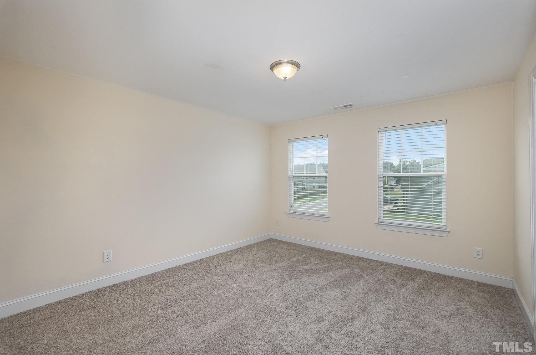 1513 Slate Ridge Road Knightdale, NC 27545 - Photo 24 of 36 an empty room with a window